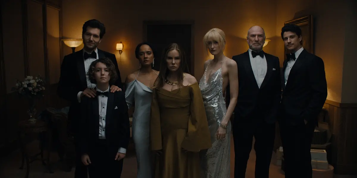 Something Very Bad Is Going To Happen. (L to R) Jeff Wilbusch as Jules, Sawyer Fraser as Jude, Karla Crome as Nell, Jennifer Jason Leigh as Victoria, Gus Birney as Portia, Ted Levine as Boris, Adam DiMarco as Nicky Cunningham in episode 107 of Something Very Bad Is Going To Happen. Cr. Courtesy of Netflix © 2026