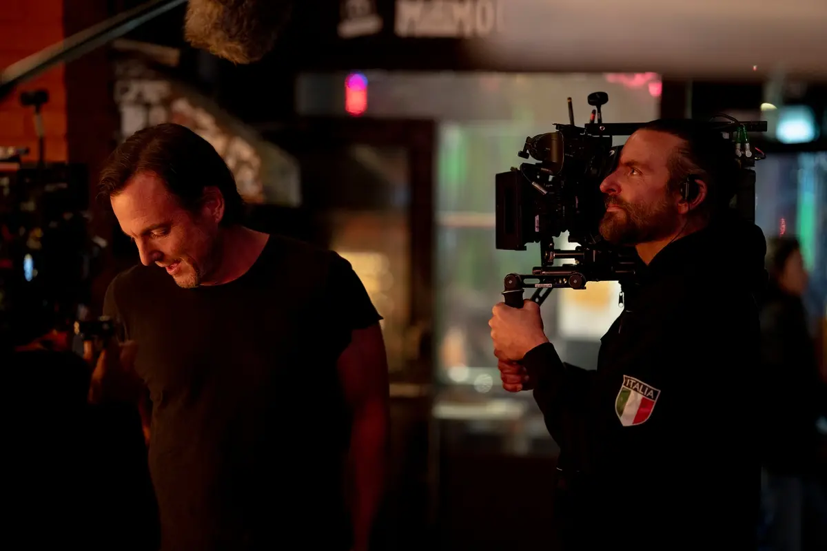 Will Arnett with director Bradley Cooper on the set of IS THIS THING ON? Photo by Searchlight Pictures/Jason McDonald, Courtesy of Searchlight Pictures. \\u00A9 2025 Searchlight Pictures All Rights Reserved. , Searchlight Pictures