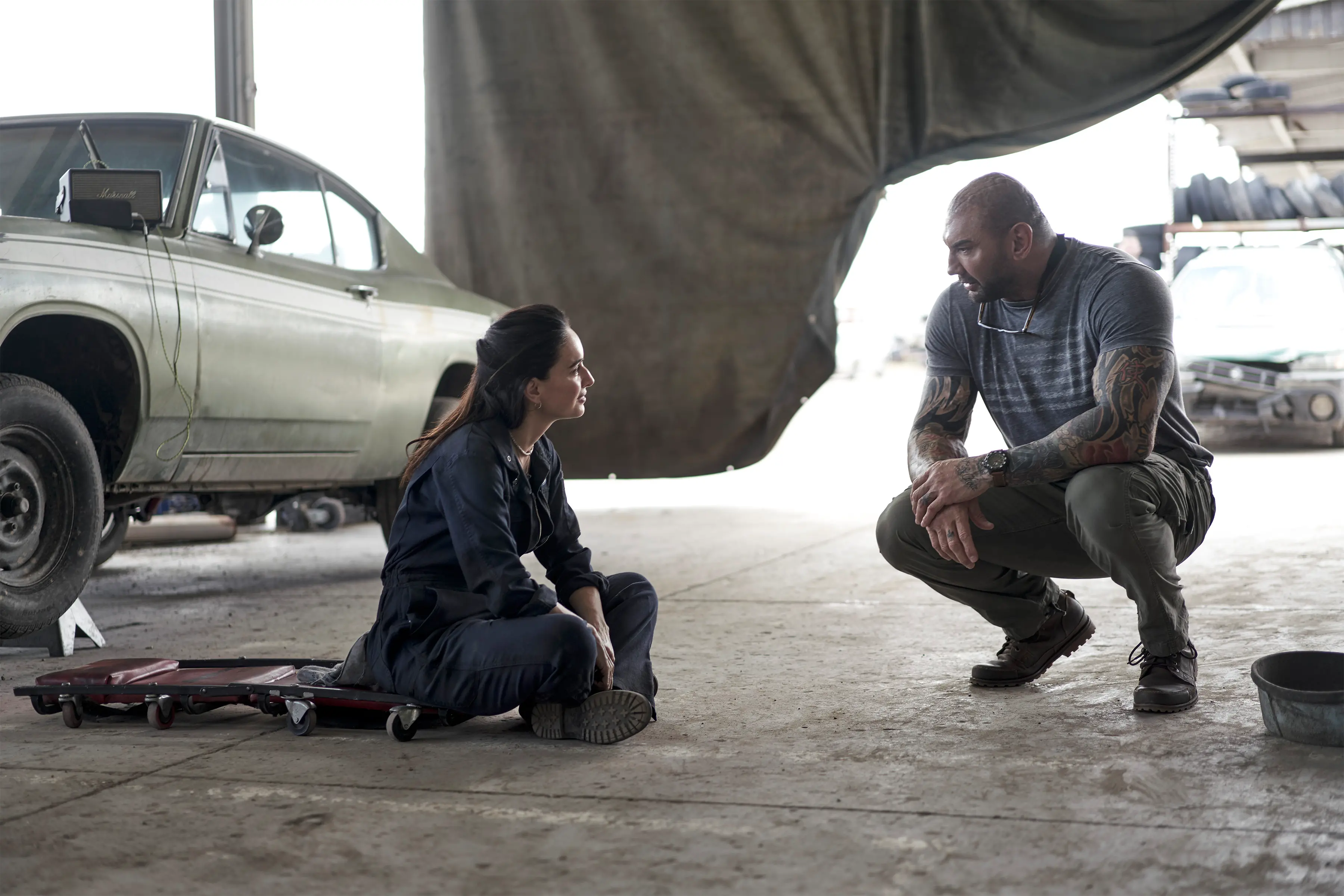 ARMY OF THE DEAD (L to R)  ANA DE LA REGUERA as CRUZ and Dave Bautista as Scott Ward in ARMY OF THE DEAD. Cr. CLAY ENOS/NETFLIX © 2021