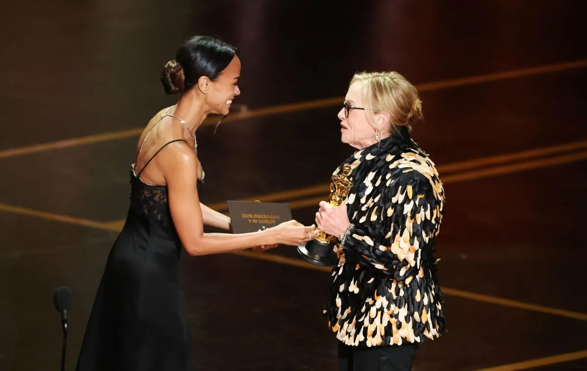 Amy Madigan receives the award from Zoe Saldana after winning the Oscars for Best Actress In A Supporting Role for 'Weapons' during the 98th annual Academy Awards ceremony at the Dolby Theatre in Los Angeles, California, USA, 15 March 2026. EPA/CHRIS TORRES