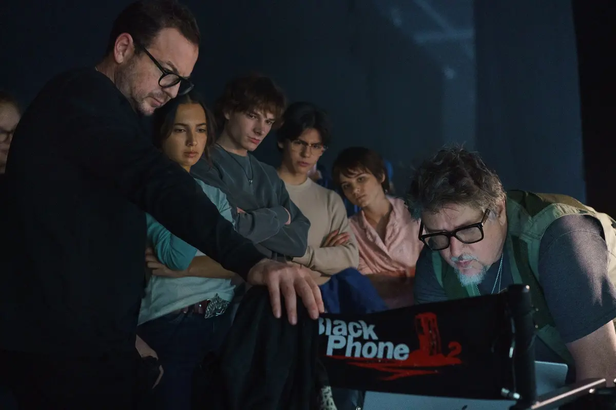 (from left) Executive Producer Jason Blumenfeld, Arianna Rivas, Mason Thames, Miguel Mora, Madeleine McGraw and Director Scott Derrickson on the set of Black Phone 2. © 2025 Universal Studios. All Rights Reserved.