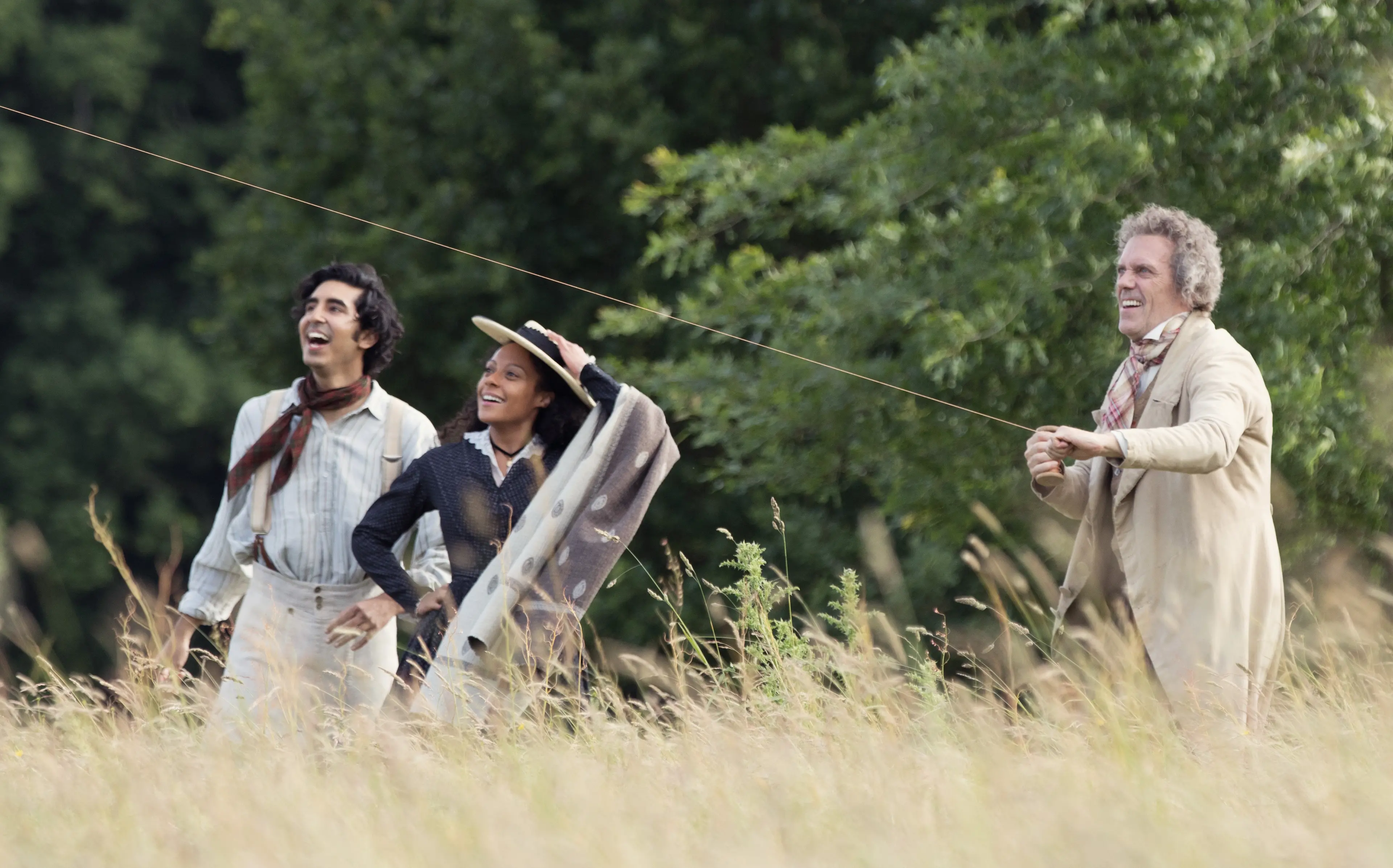 Dev Patel, Rosalind Eleazar and Hugh Laurie in the film THE PERSONAL HISTORY OF DAVID COPPERFIELD. Photo by Dean Rogers. © 2019 Twentieth Century Fox Film Corporation All Rights Reserved