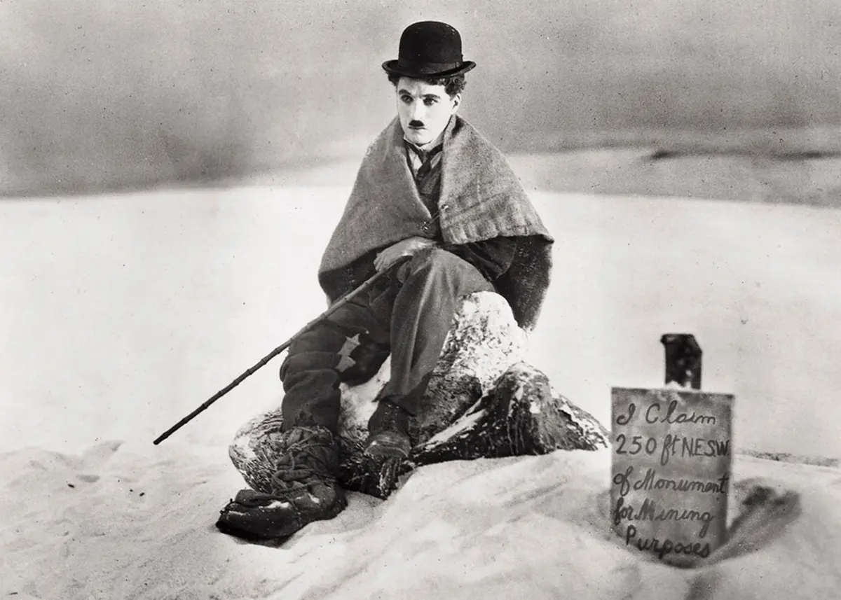 ** FILE **Legendary silent film actor-director Charlie Chaplin is shown in a scene from the 1925 silent film \\\"The Gold Rush,\\\" in this promotional photo. Four of Chaplin's films \\\"The Gold Rush,\\\" \\\"The Great Dictator,\\\" \\\"Modern Times,\\\" and \\\"Limelight,\\\" are being released on DVD July 1, 2003, from Warner Home Video, as the first in a series of ten titles included in \\\"The Chaplin Collection.\\\" (AP Photo/The Roy Export Company Establishment, HO). HOUCHRON CAPTION (03/03/2004): After the premiere of \\\"Charlie: The Life and Art of Charles Chaplin\\\" at 7 tonight on TCM, the tribute continues with a Chaplin film festival featuring 36 short films.