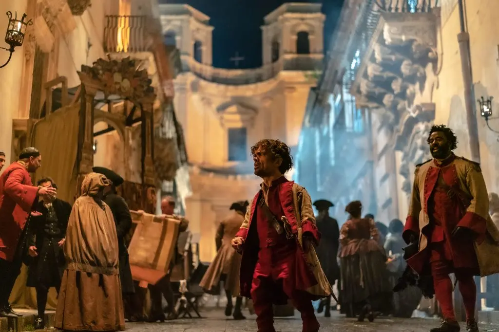 Peter Dinklage stars as Cyrano and Bashir Salahuddin as Le Bret in Joe Wright\\u2019s<br>CYRANO<br>A Metro Goldwyn Mayer Pictures film<br>Photo credit: Peter Mountain<br>\\u00A9 2021 Metro-Goldwyn-Mayer Pictures Inc. All Rights Reserved.
