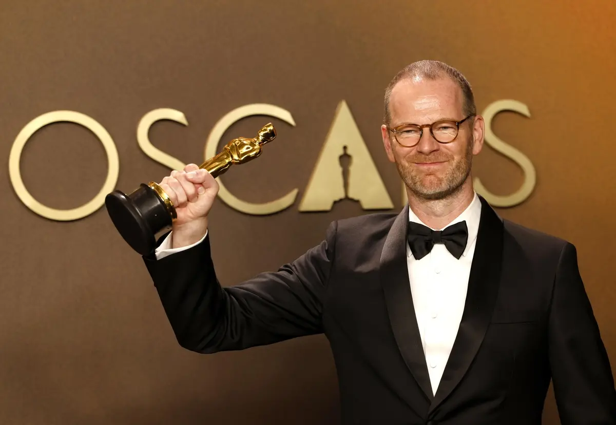 epa12824270 Joachim Trier poses with the award for Best International Feature for 'Sentimental Value' during the the 98th annual Academy Awards ceremony at the Dolby Theatre in Los Angeles, California, USA, 15 March 2026. EPA/JILL CONNELLY