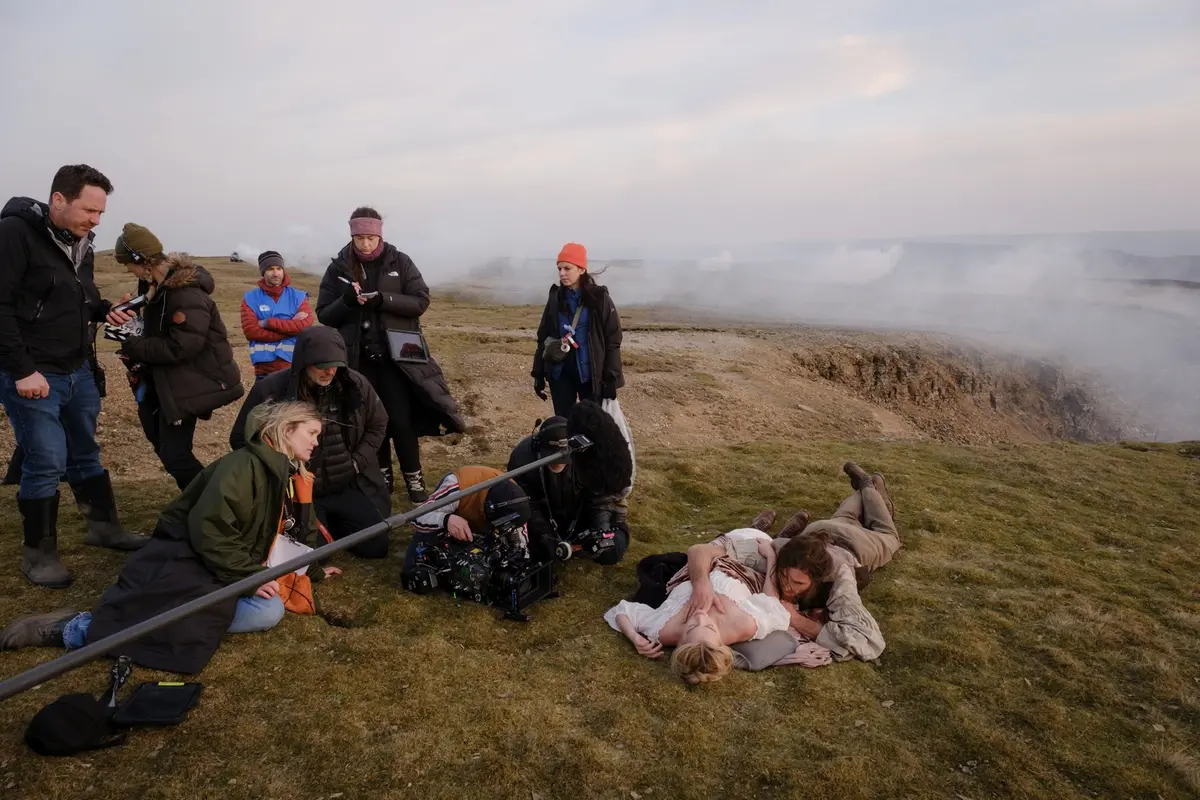(L-r) Director, Writer, Producer EMERALD FENNELL, Cinematographer LINUS SANDGREN, Actor, Producer MARGOT ROBBIE and JACOB ELORDI on the set of “Wuthering Heights,” a Warner Bros. Pictures Release.