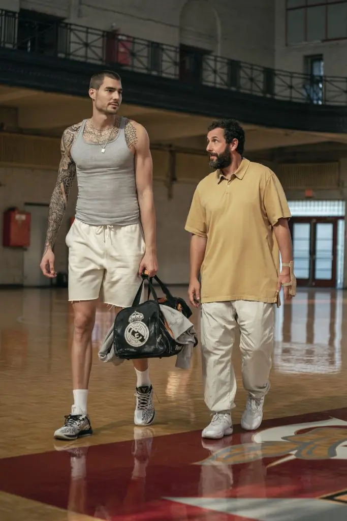 HUSTLE. (L-R) Juancho Hernangomez as Bo Cruz and Adam Sandler as Stanley Sugerman in Hustle. Cr. Cassy Athena/Netflix © 2022.