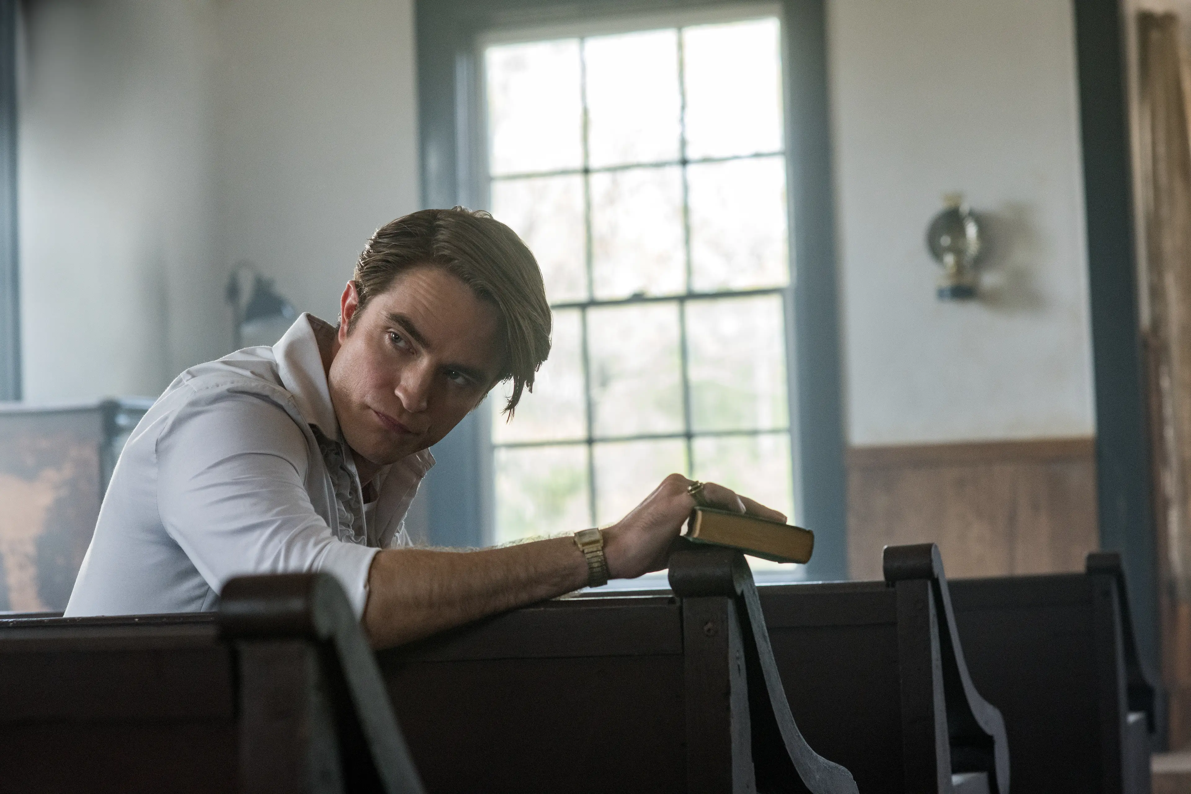 The Devil All The Time: Robert Pattinson as Preston Teagardin. Photo Cr. Glen Wilson/Netflix \\u00A9 2020