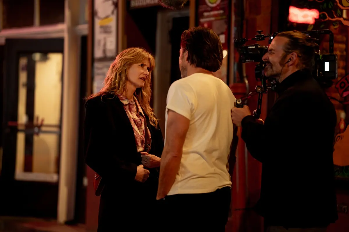 Laura Dern and Will Arnett with director Bradley Cooper on the set of IS THIS THING ON? Photo by Searchlight Pictures/Jason McDonald, Courtesy of Searchlight Pictures. © 2025 Searchlight Pictures All Rights Reserved.