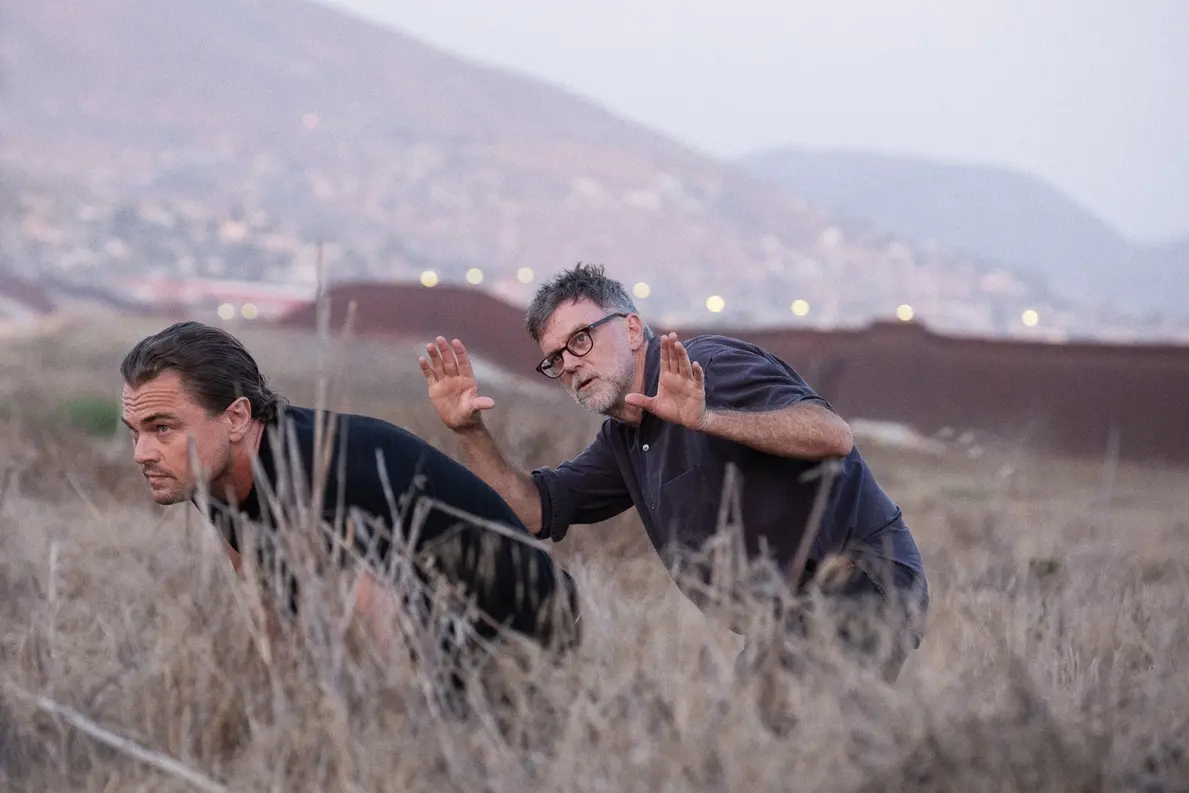 (L-r) LEONARDO DI CAPRIO and Director/Writer/Producer PAUL THOMAS ANDERSON on the set of \\u201COne Battle After Another.\\u201D A Warner Bros. Pictures Release. , Merrick Morton