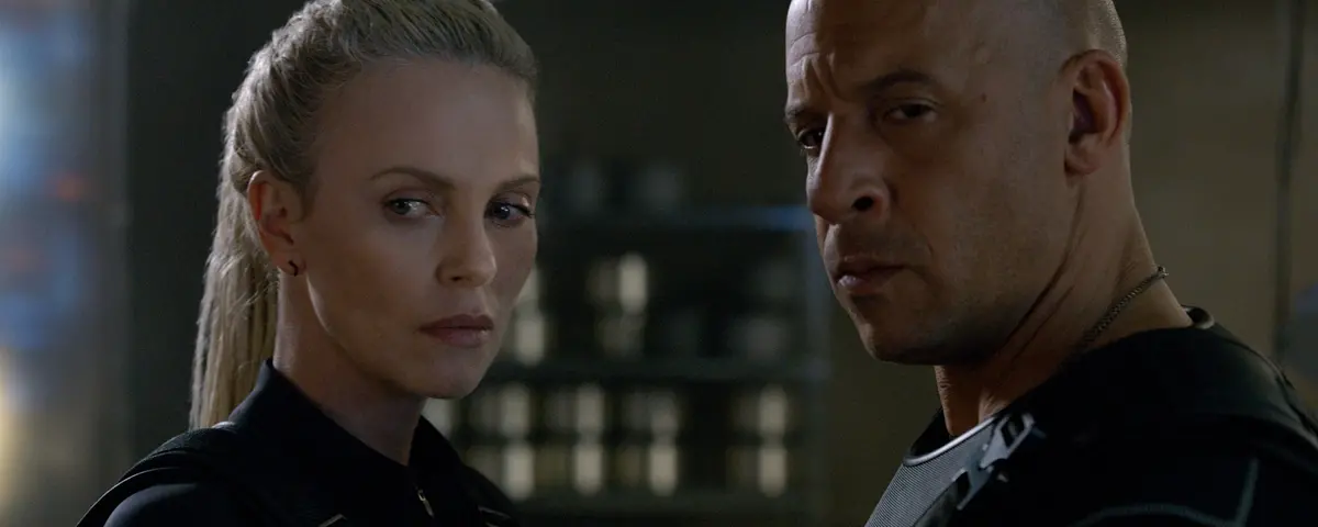 The aptly named villain Cipher (Charlize Theron) recruits Dominic Toretto (Vin Diesel) in The Fate of the Furious.