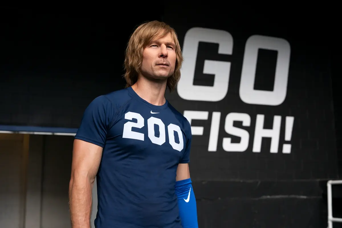 CHAD POWERS - Eight years after an unforgivable mistake nukes his promising college football career, hotshot quarterback Russ Holliday tries to resurrect his dreams by disguising himself as Chad Powers - a talented oddball who walks on to the struggling South Georgia Catfish. (Disney/DJ Delgado) GLEN POWELL