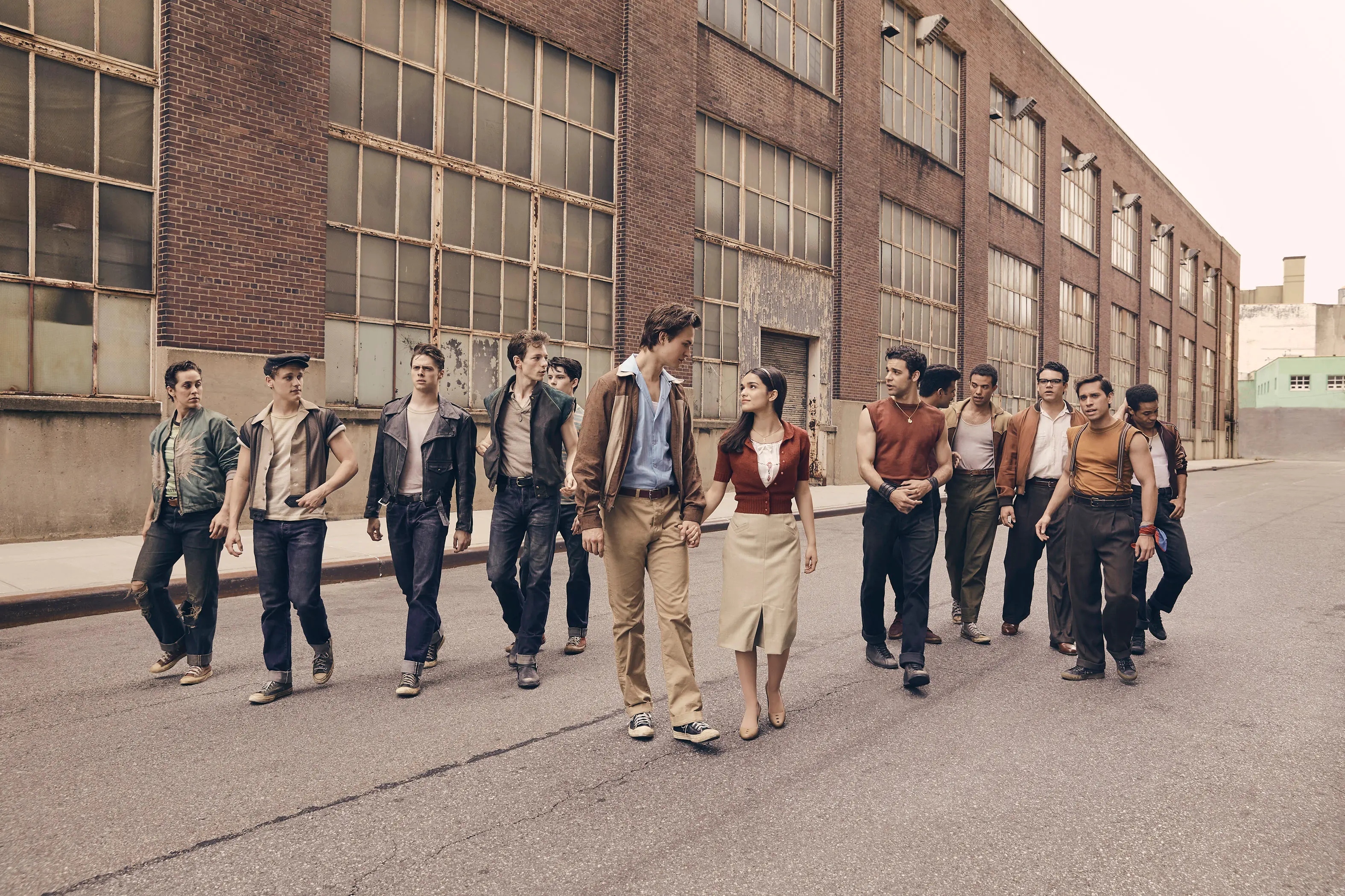 © 2020 Twentieth Century Fox Film Corporation. All Rights Reserved. Photo by Ramona Rosales..(Left to Right:) Anybodys (Ezra Menas), Mouthpiece (Ben Cook), Action (Sean Harrison Jones); Jets leader Riff (Mike Faist); Baby John (Patrick Higgins); Tony (Ansel Elgort) and Maria (Rachel Zegler); Maria’s brother and Sharks leader Bernardo (David Alvarez); and Sharks members Quique (Julius Anthony Rubio), Chago (Ricardo Zayas), Chino (Josh Andrés Rivera), Braulio (Sebastian Serra) and Pipo (Carlos Sánchez Falú).