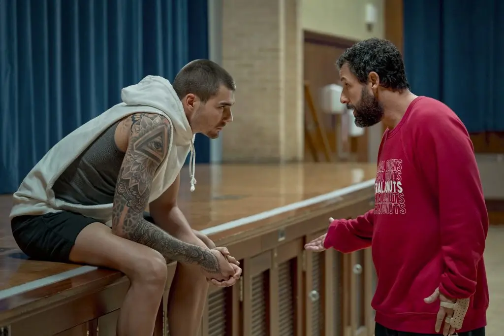 HUSTLE. (L-R) Juancho Hernangomez as Bo Cruz and Adam Sandler as Stanley Sugerman in Hustle. Cr. Scott Yamano/Netflix \\u00A9 2022.
